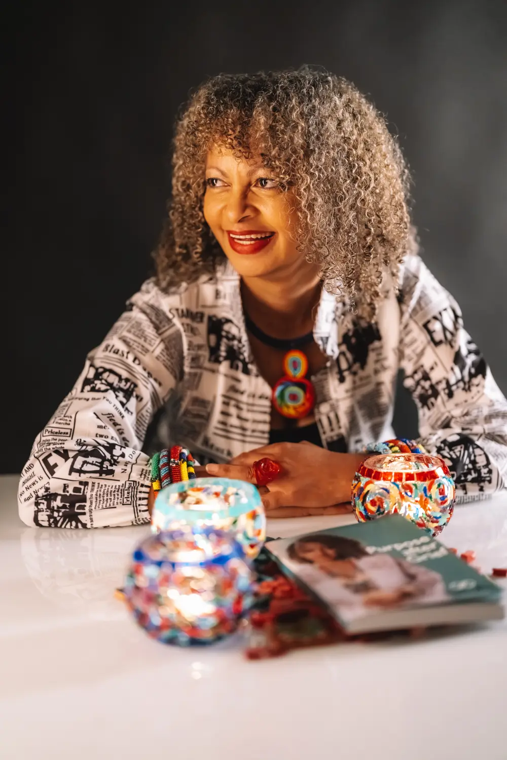 Natlie and mosaic decoration, along with her book on table